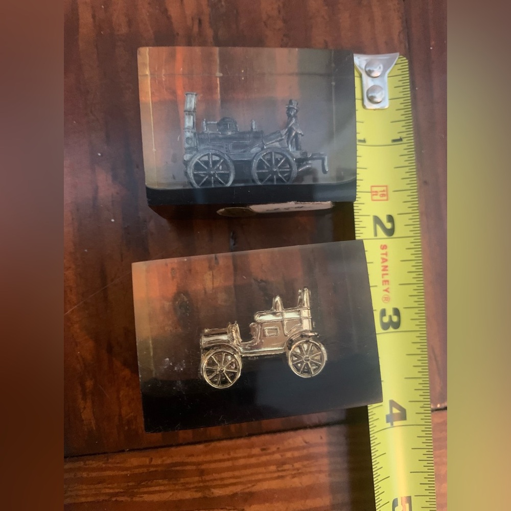 Two vintage Lucite acrylic paperweight suspended metal miniature train conductor